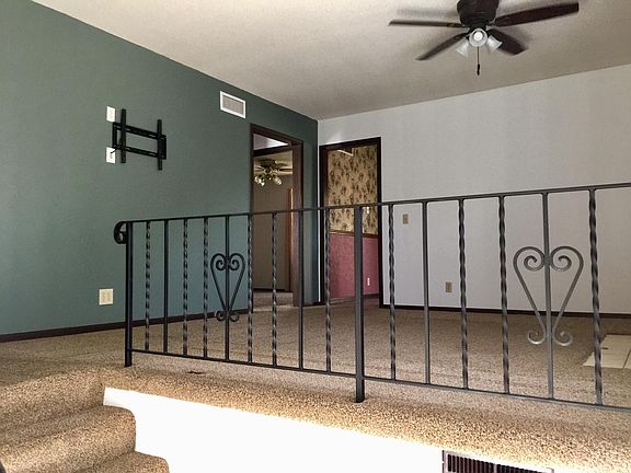 Upstairs living room with a wall mount for a TV.