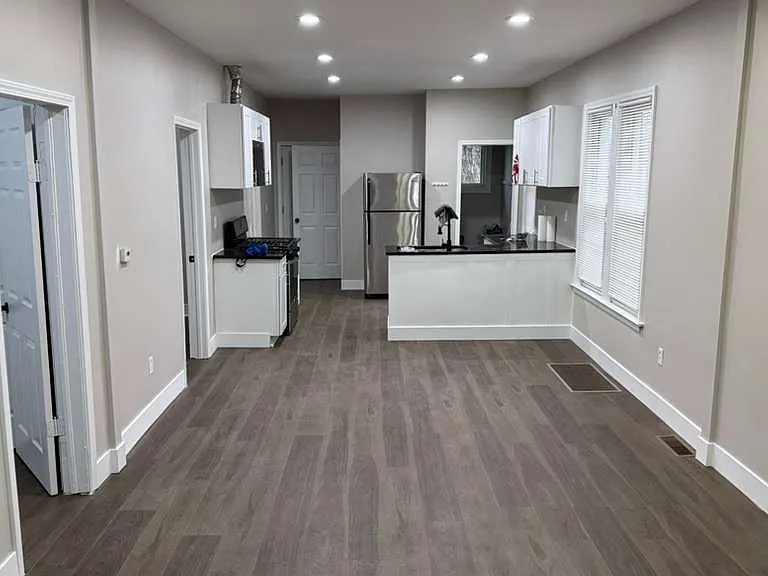 View of the kitchen from the open floor plan for Living room, dining room, kitchen and Laundry room.