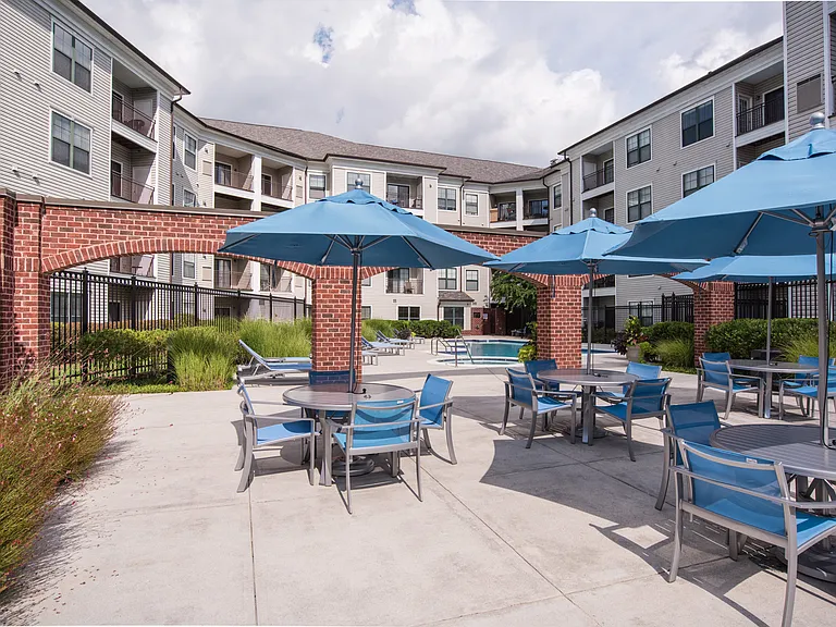Outdoor Courtyard with Seating Areas and Lounging Chairs