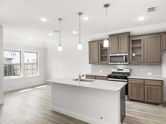 Prosper floor plan showcasing open-concept single-story living with a dining area, covered patio, an