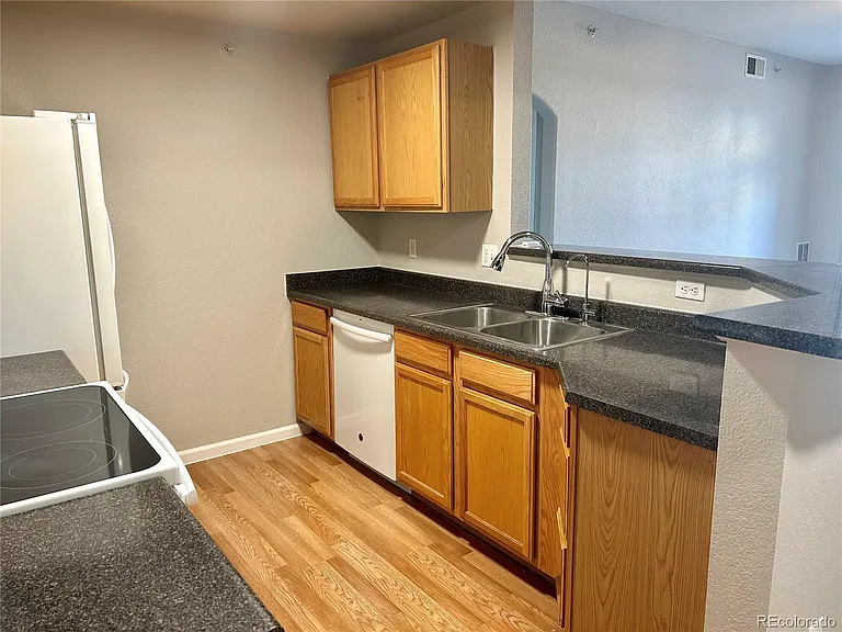 7440 S Blackhawk St #203 — Photo 7