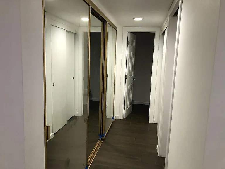 Hallway closets main triple door closed on left