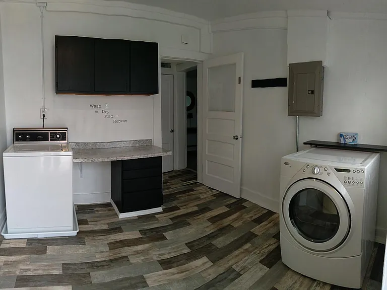 Laundry room with full size washer and dryer.