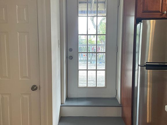 Coat closet & door to deck.