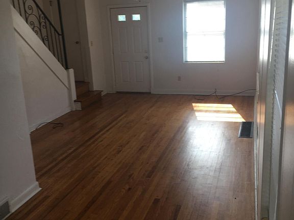 First floor dining and living area, facing front of home