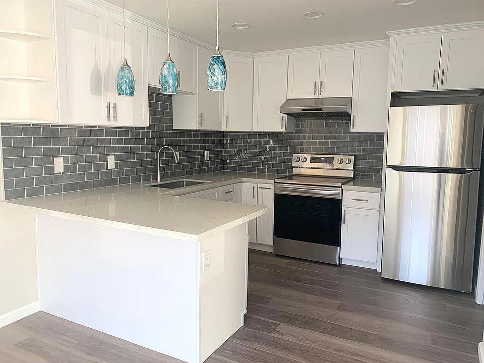 The Kitchen has been fully remodeled with new cabinets, countertop, sink, stainless appliances, and a beautiful stone backsplash. Recess lighting throughout and 3 enchanting pendant lights.