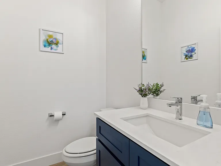This beautiful powder room is available for your guests on the main floor.