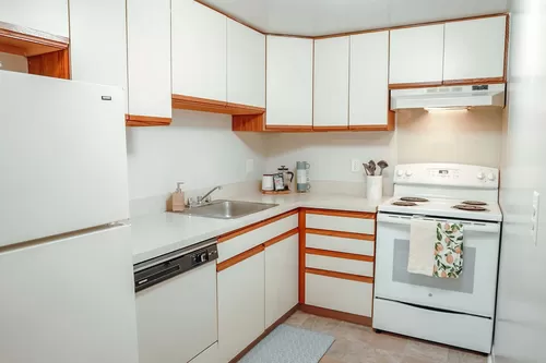 Kitchen (cabinets & appliances vary) - Golfside Lake Apartments & Town Houses