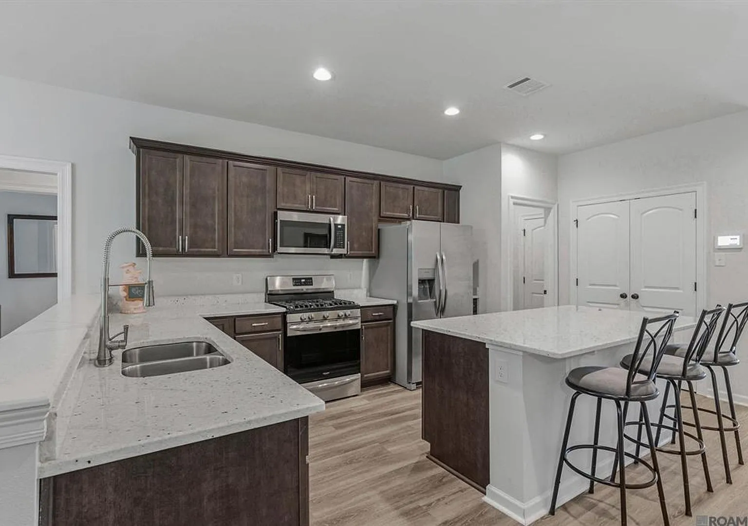 Modern 3 Bedroom Home with Private Backyard Views in Forestwood — Photo 3
