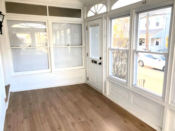 Entrance to the front of the house & enclosed porch