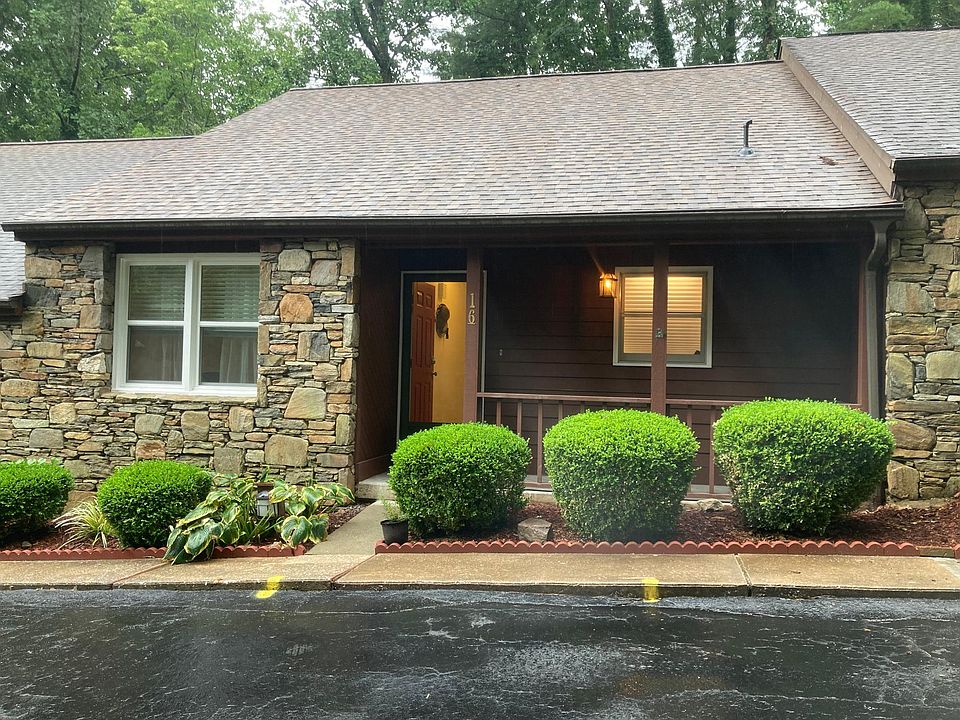 Front of townhouse. Front porch and 2 parking spaces.