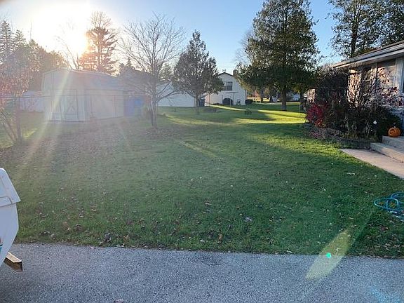 Front yard from the driveway facing west...into the sun.