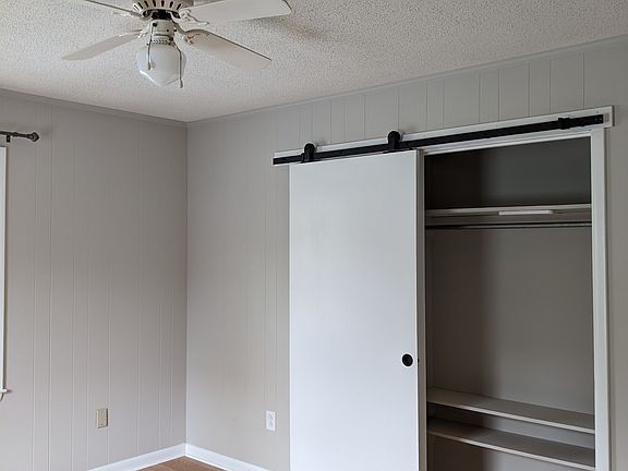 Master bedroom has a roomy closet with new barn door for better access.
