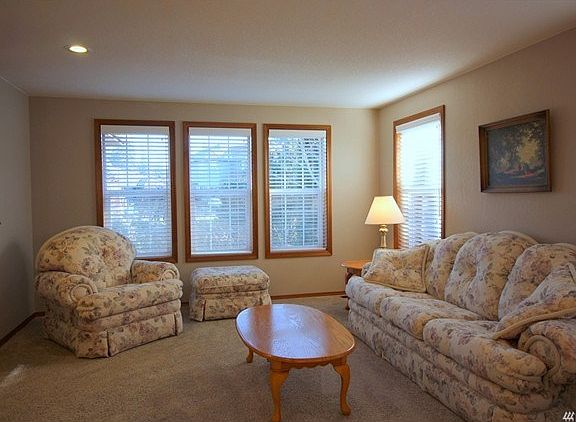 The formal living room is just off the entry and adjoins the dining room.