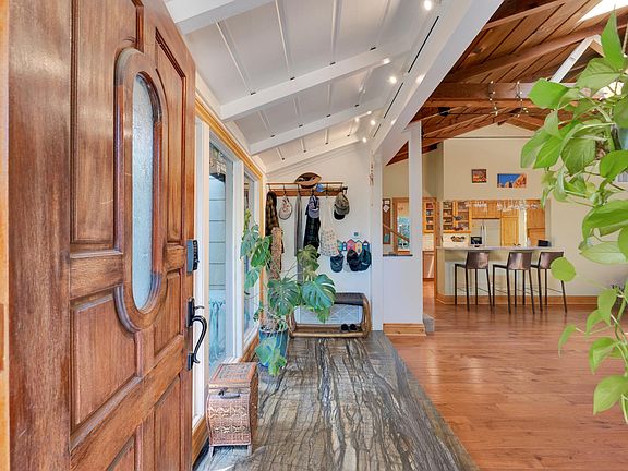 Entry hall with slab stone flooring