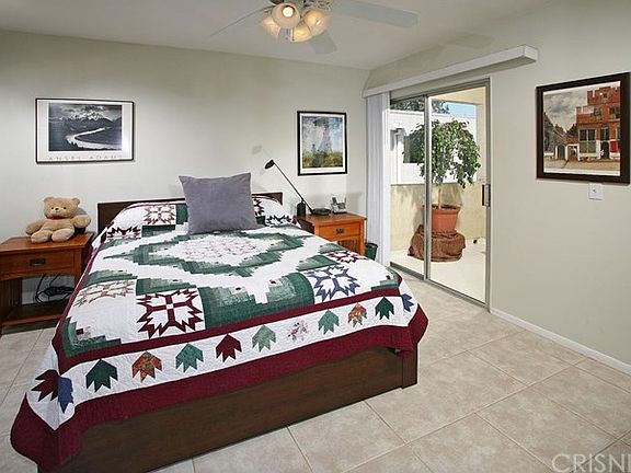 The spacious master suite is bathed in natural lig