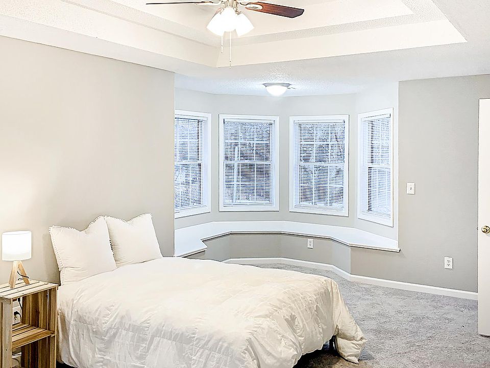 Large suite with built in seating around expansive bay window