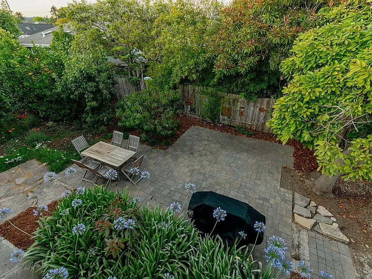 Shared garden oasis with BBQ grill