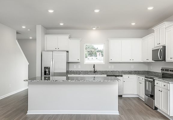 The kitchen overlooks the living area