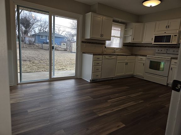 In kitchen looking out to the new patio doors to the back yard