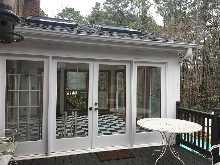 Deck for grilling, adjacent sunroom