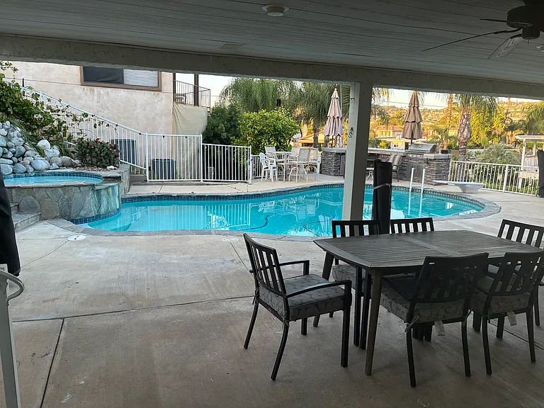 View of pool, bbq from door.