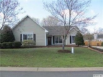 Front View of house and hidden 2-car Garage
