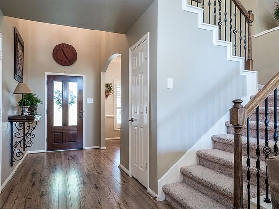 Welcoming entryway boasts gorgeous flooring that flows into the formal dining and family room!