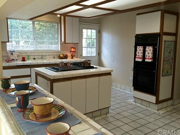 Large pass-through window w/breakfast counter between living room and kitchen.