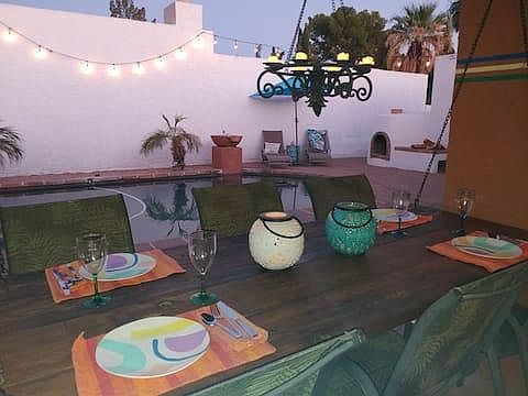 Swinging picnic table next to pool