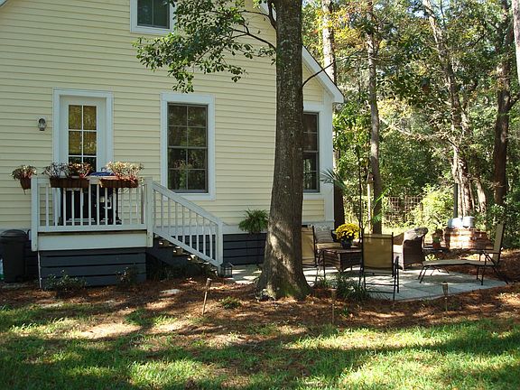 large lawn with grilling porch and tabby patio