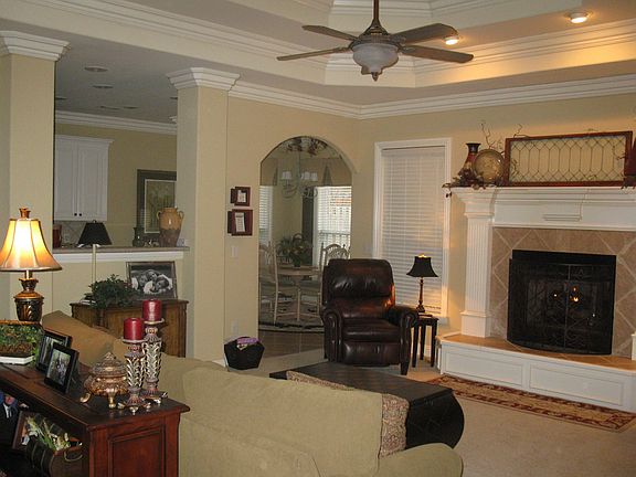 Living Room into arched doorway kitchen