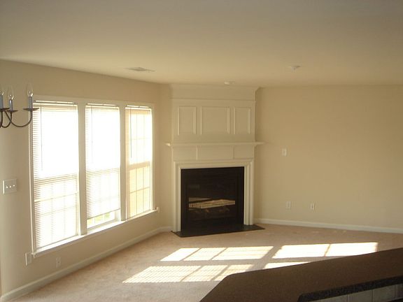 Large Family Room w/ plenty of natural sunlight and gas fireplace
