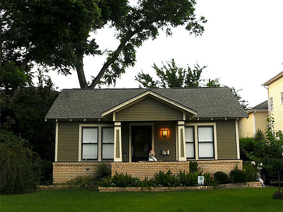 A must see endearing bungalow with an abundance of windows and a backyard you can escape to!