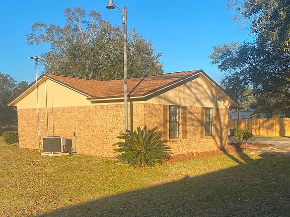 SIDE AND FRONT VIEW OF HOUSE