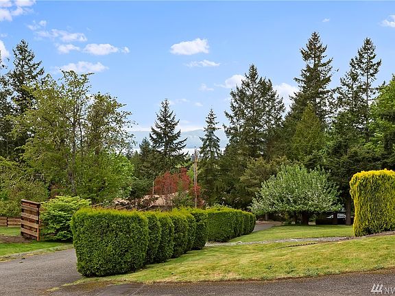 Water and mountain views can also be seen from the driveway.