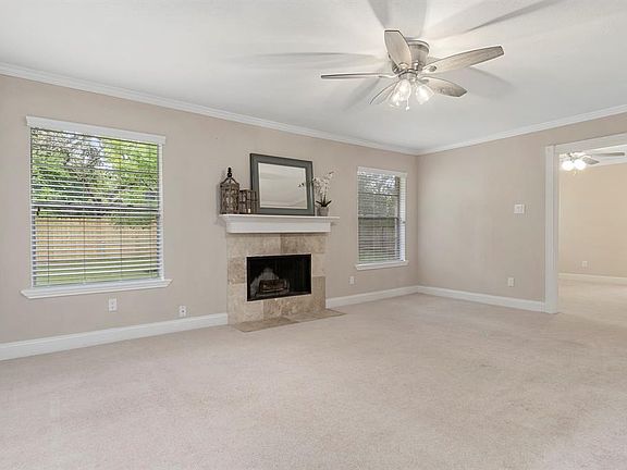 This large living room is full of natural light with the two large windows. You will love the cozy fireplace in the winter!