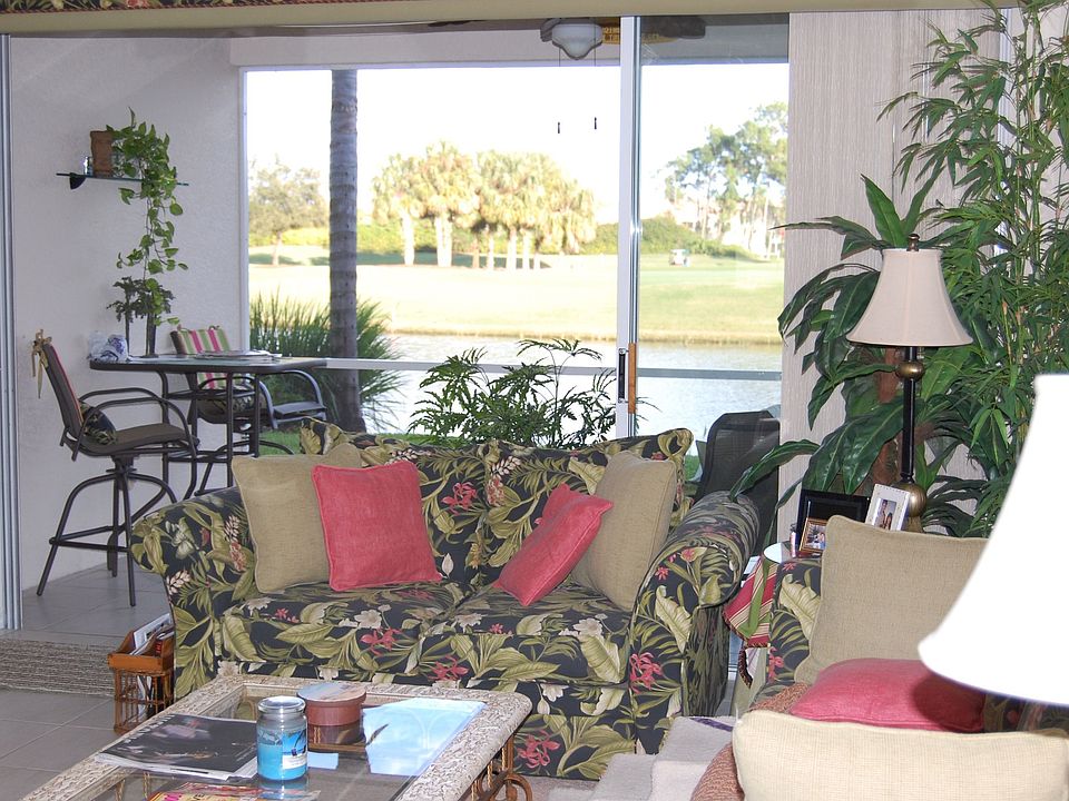 Living room & Lanai overlooking golf course and lake