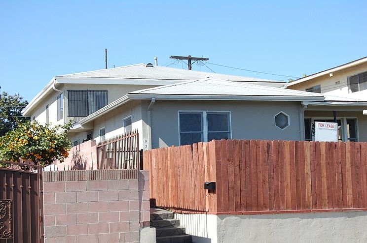 Duplex has original 2 bedroom house in front, with larger 3