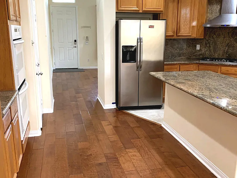View of Kitchen and Living room. That door is the main entrance