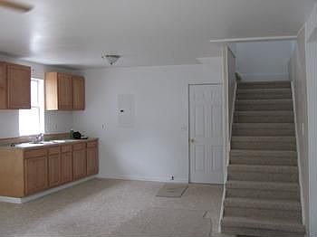 Kitchen area and stairs to second floor.