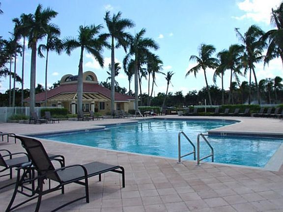 Pool and Sun deck overlooking beautifully landscaped lakes with fountains