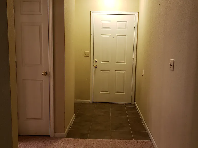 Entry door showing coat closet.