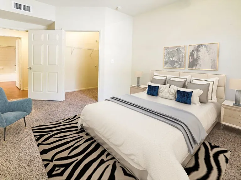 Large bedroom with plush carpeting at Stonehaven Apartments in Houston, TX
