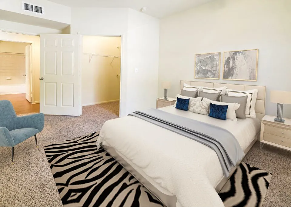 Large bedroom with plush carpeting at Stonehaven Apartments in Houston, TX