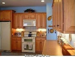 Huge kitchen with lots of cabinets and counter space