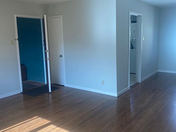 Front door opens to living room with courtyard views