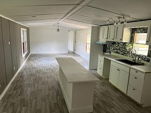 Great new kitchen, kitchen island, accent wall, new lighting fixtures