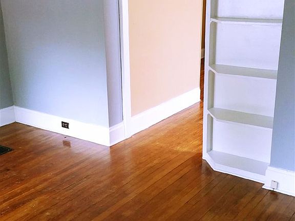Living room shelving & entrance into bdrm