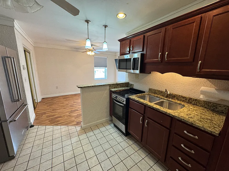 Open concept kitchen looking into Living Room